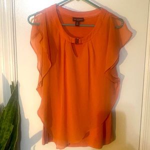 Orange split flutter sleeve blouse with gold neck closure